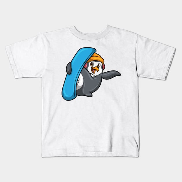 Penguin at Snowboarding with Snowboard and Hat Kids T-Shirt by Markus Schnabel